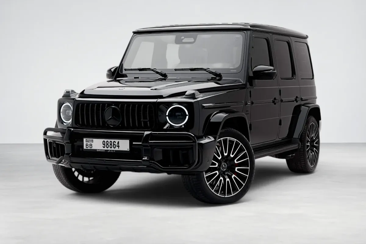 Black Mercedes-AMG G63 in a white studio